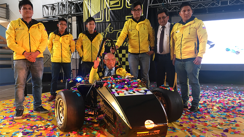Javier Herrán, UPS president in the Formula SAE vehicle, Cesar Vasquez, vice president of UPS's branch in Cuenca and the Formula SAE team