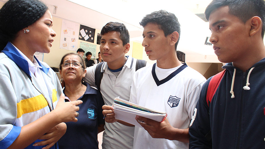 Eduarda González, UPS student, talking to students about a hybrid vehicle