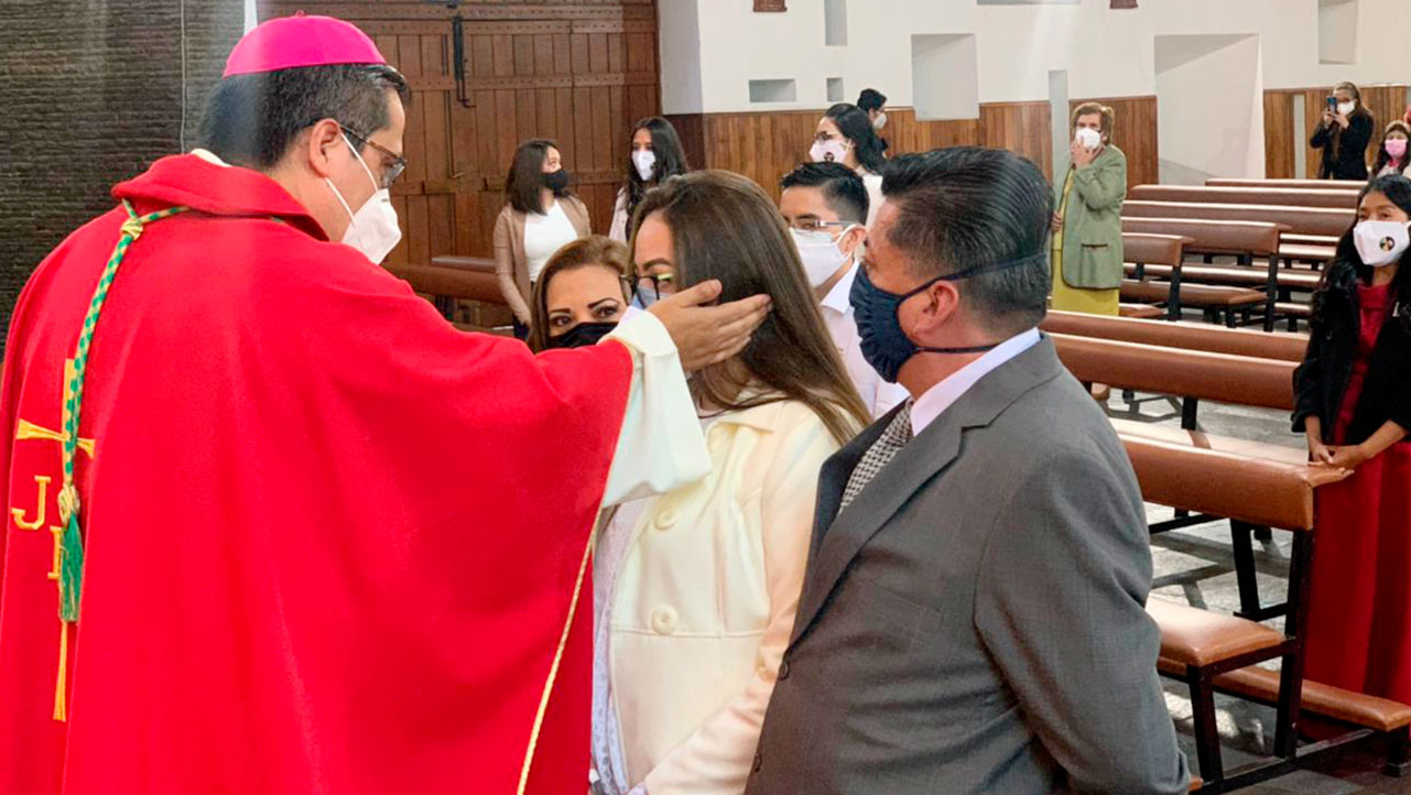 Monsignor David De La Torre celebrates the sacrament of confirmation